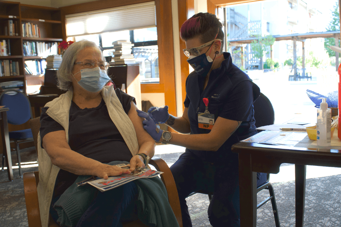 senior getting covid vaccination