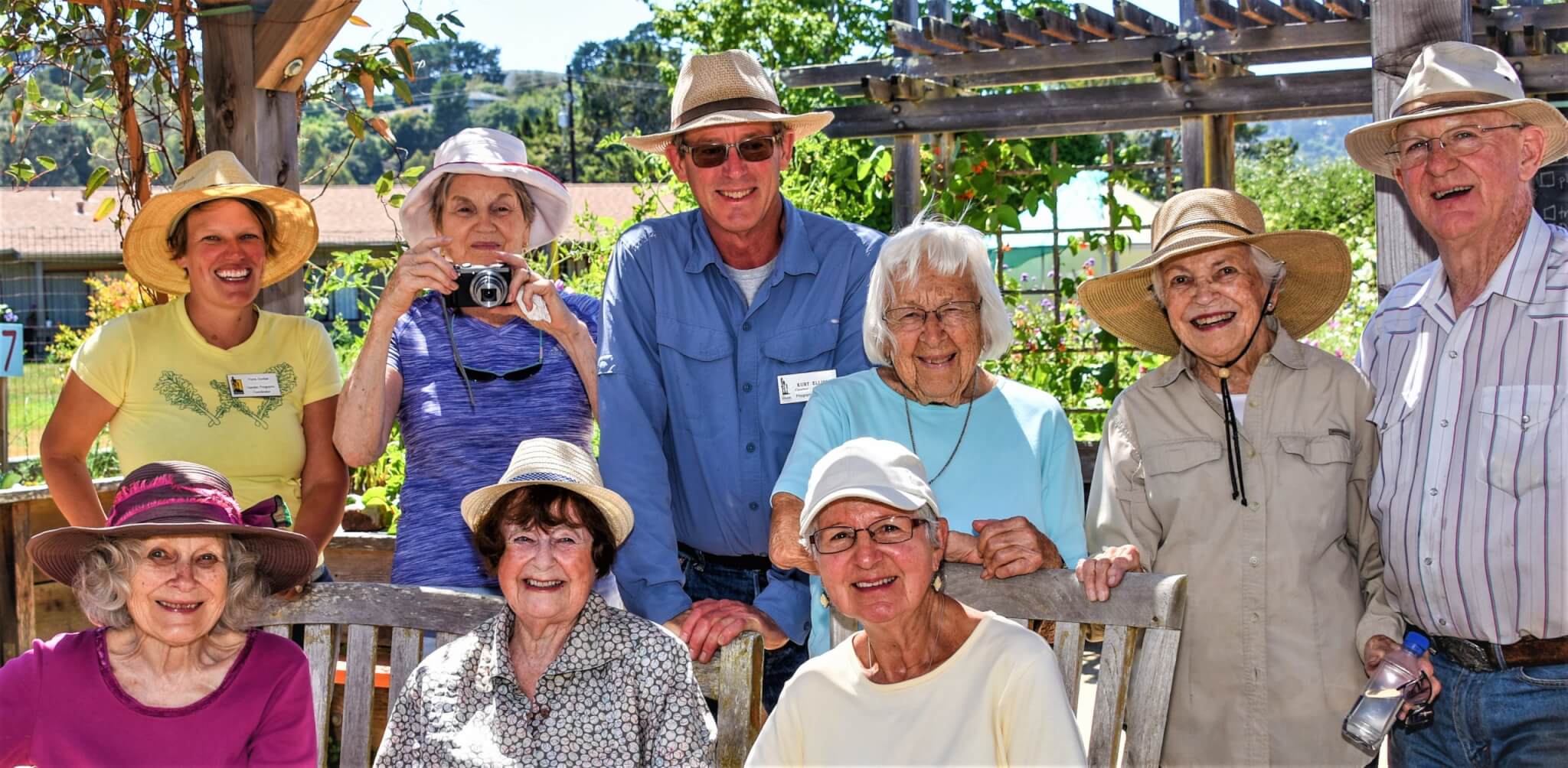residents posing in organic garden